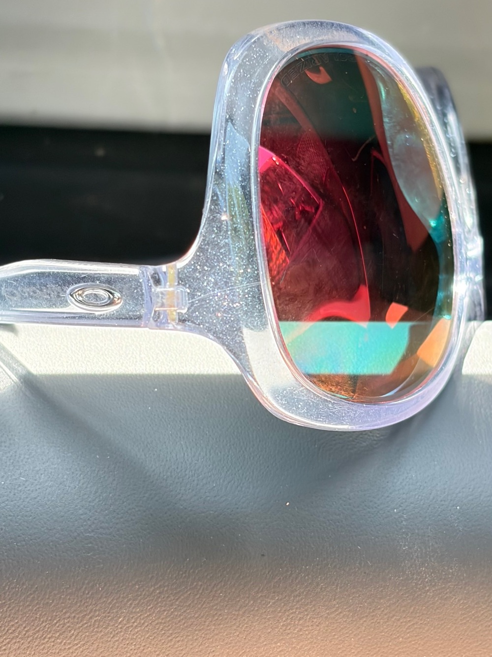 Oakley Clear Frame Sunglasses with Pink-Red Mirrored Lenses